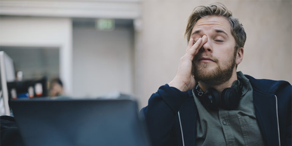 A man looking very tired